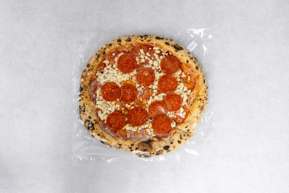 Ready: fertig belegte und vakuumierte Pizza