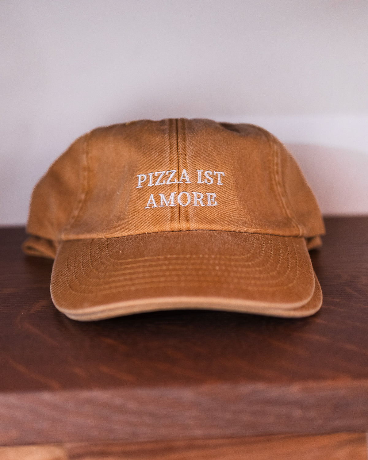 Kappe mit dem Spruch „PIZZA IST AMORE“